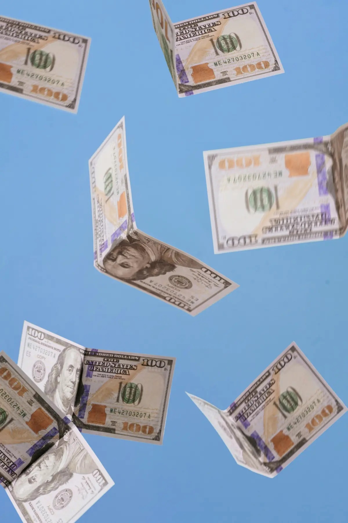 Dollar bills flying in the sky