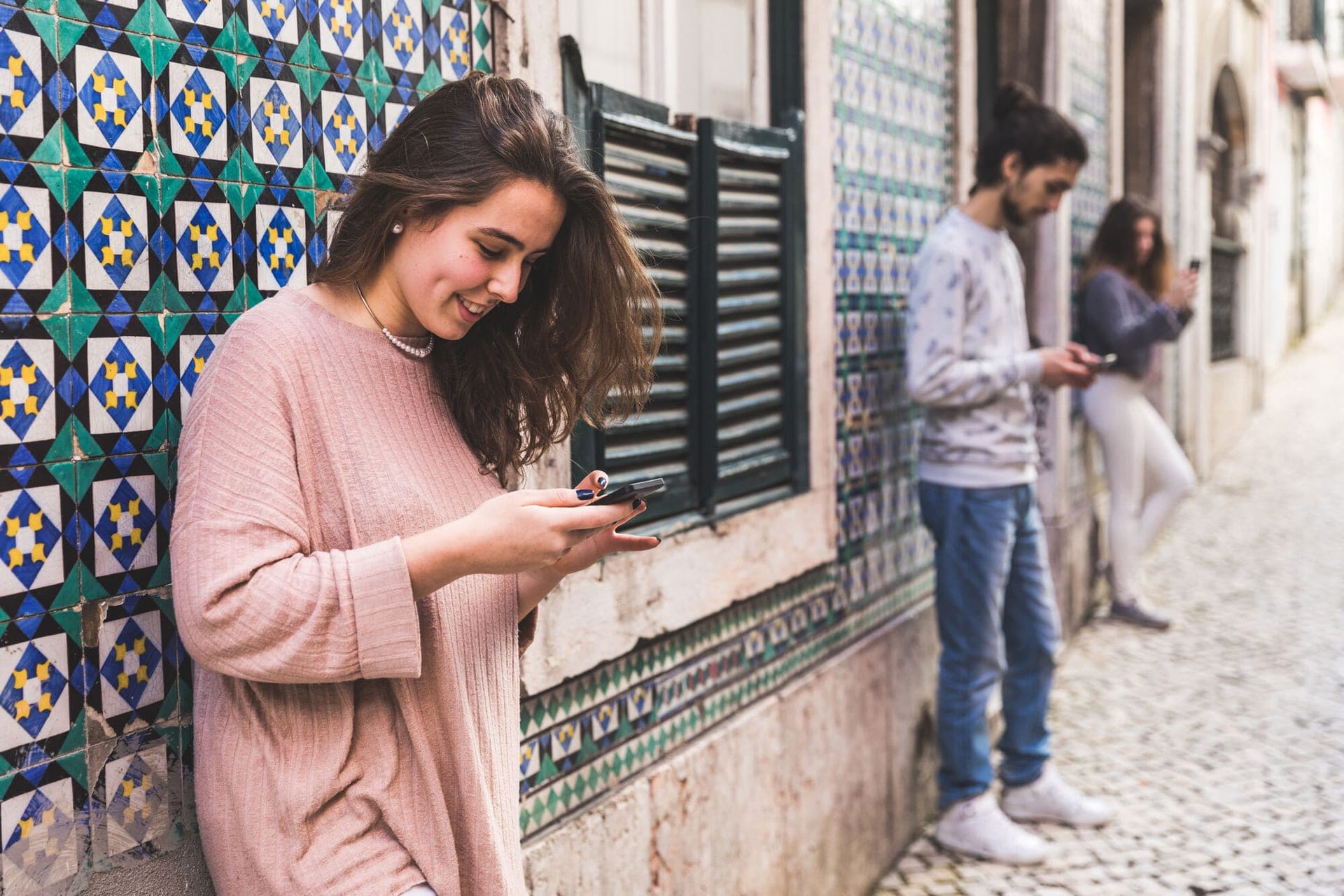 Woman with laptop and phone