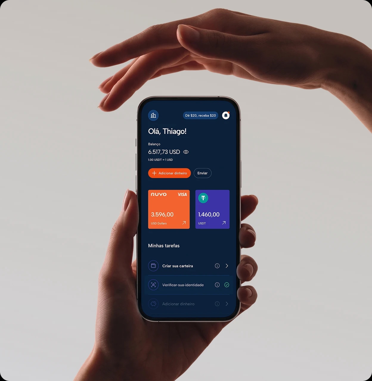 Hand holding a phone with the Ruvo app open