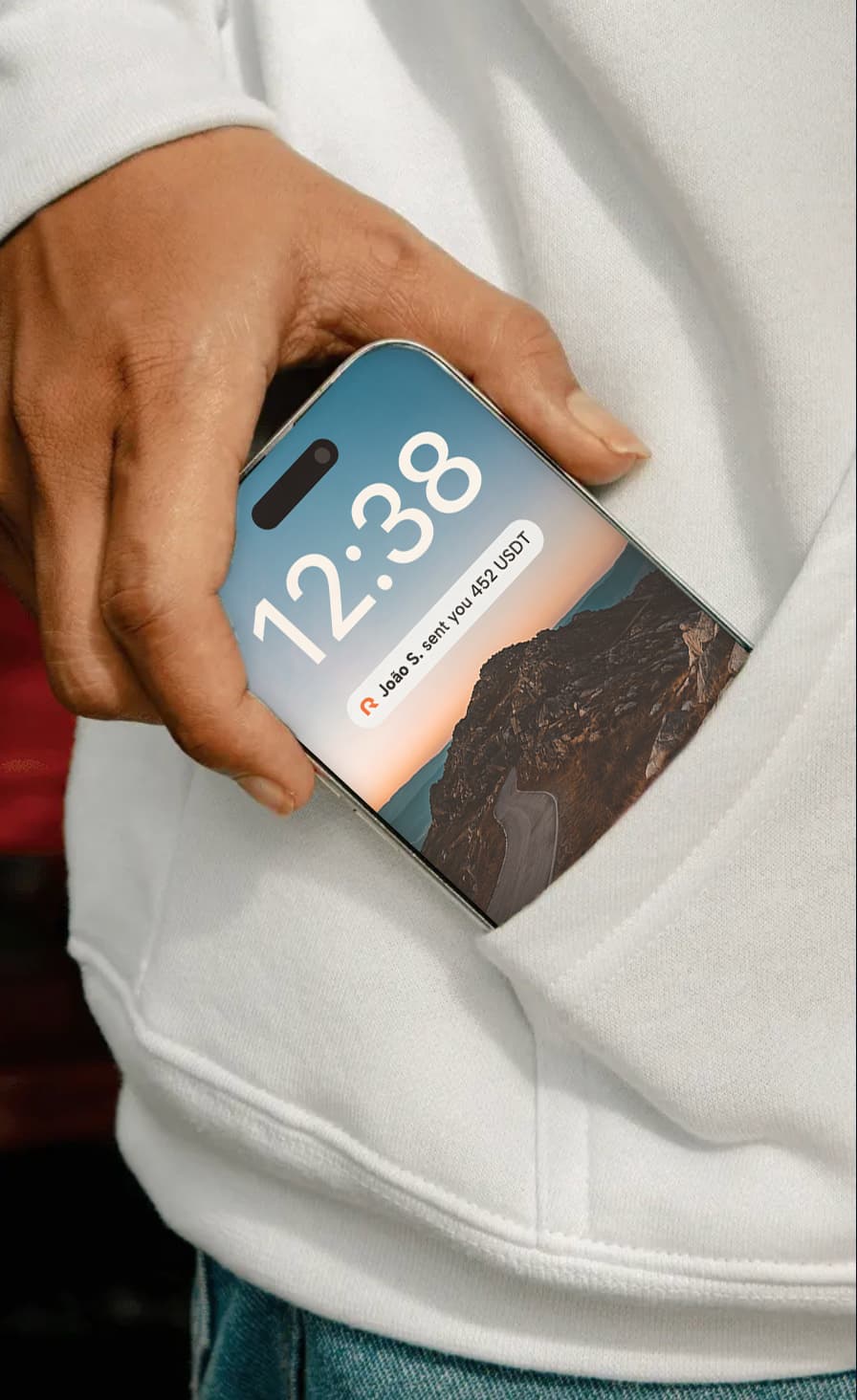 Brazilian professional receiving a USD salary on their phone