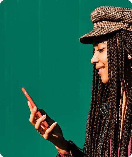 Woman wearing a hat using her phone